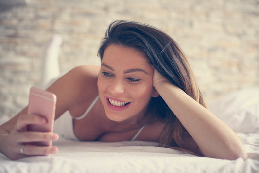 Woman sexting with partner to enhance intimacy 
