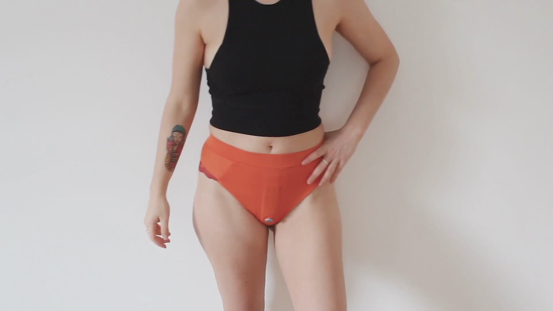 video showing a girl wearing an orange classic lingerie harness